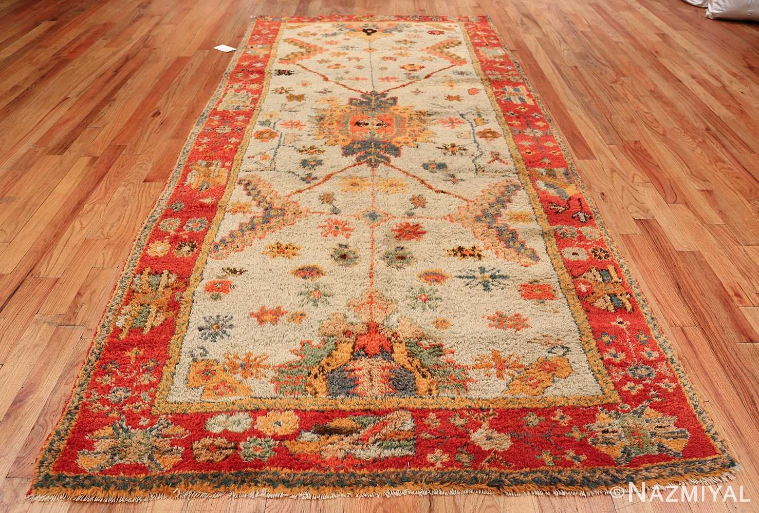 https://cdn.nazmiyalantiquerugs.com/wp-content/uploads/2018/09/watermark/light-blue-background-antique-turkish-oushak-rug-49834-whole-design.jpg