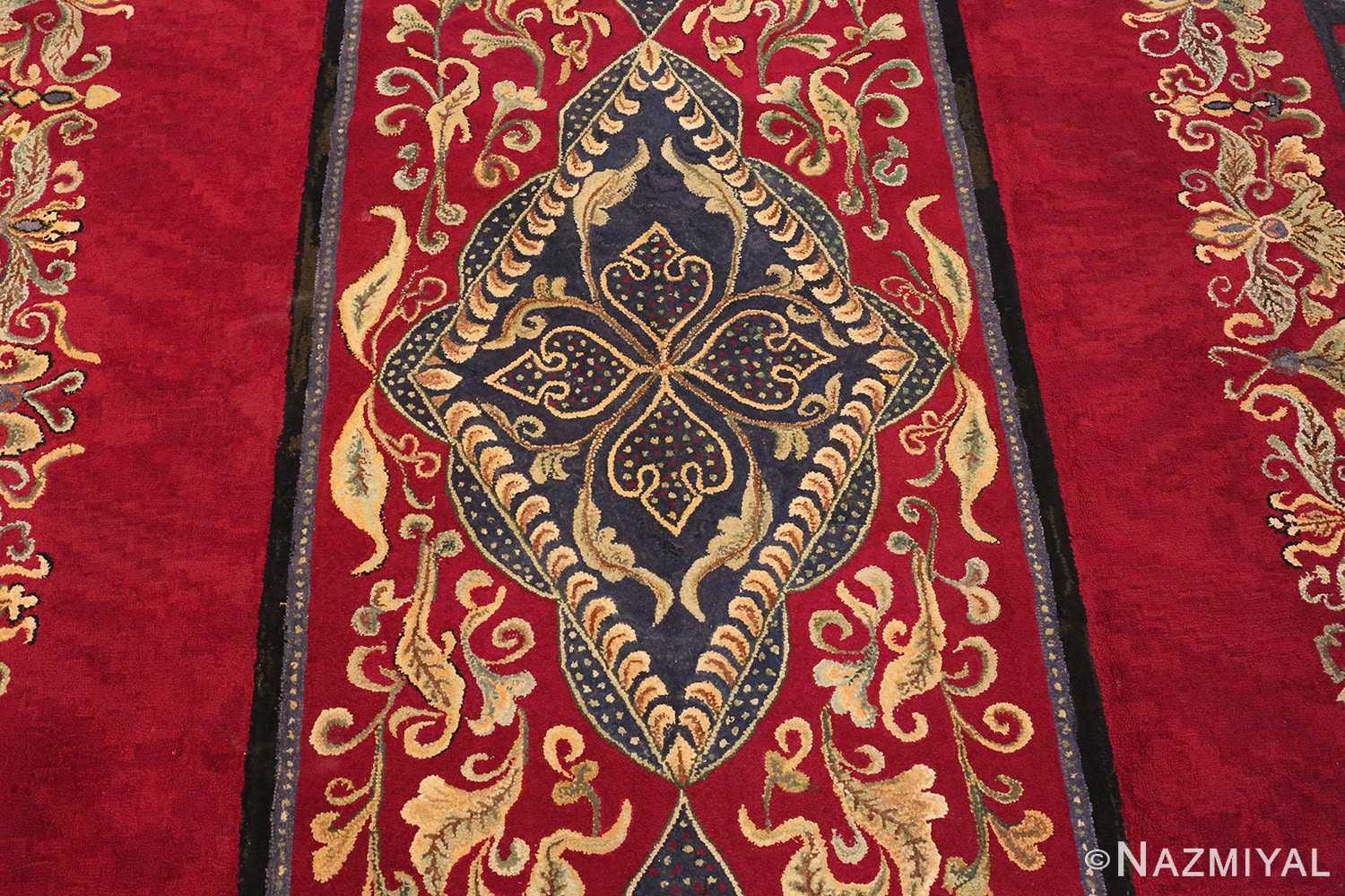 Picture of the central medallion design of the red Medallion Design Antique American Hooked Rug #70059 from Nazmiyal Antique Rugs in NYC