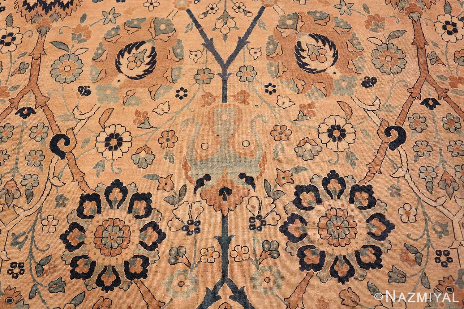 A detail blue flower picture of the large vase design antique persian kerman rug #50701 from Nazmiyal Antique Rugs NYC