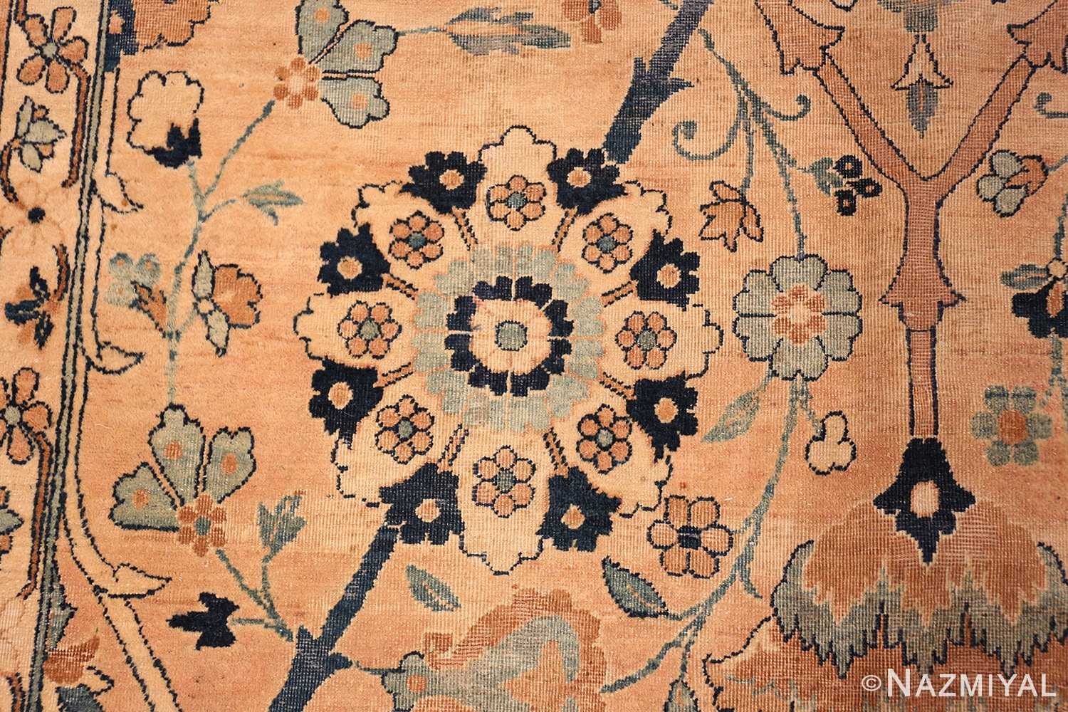 A detailed picture of center flower of the large vase design antique persian kerman rug #50701 from Nazmiyal Antique Rugs NYC