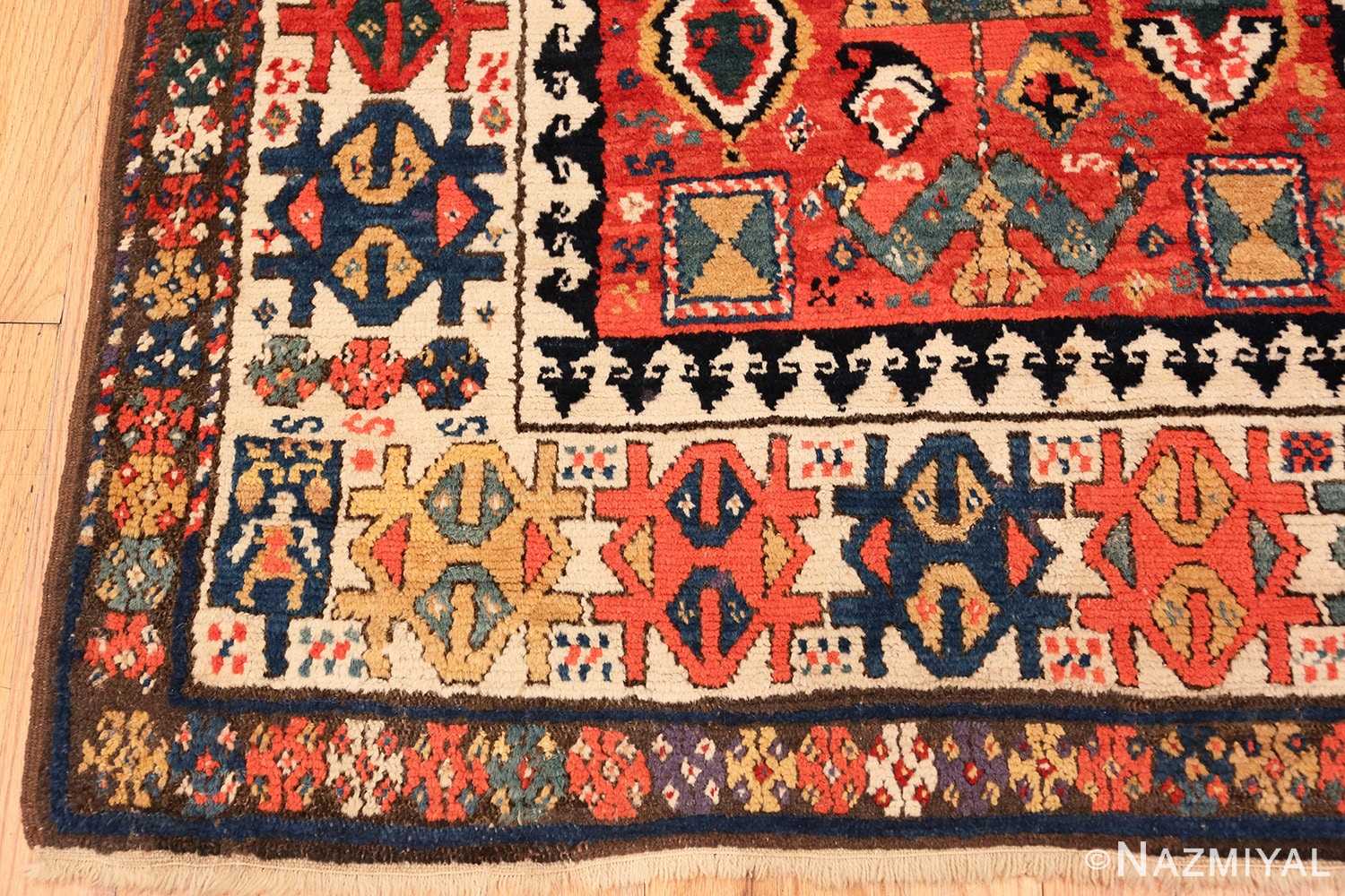 Corner Antique Kazak Caucasian rug 70122 by Nazmiyal